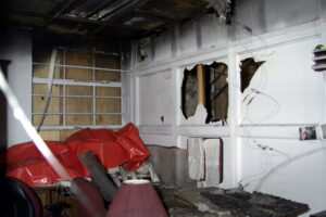 Internal view showing smoke and water damage, caused by a fire, to one of the Judge Advocate offices at Building 101, 1st Army Headquarters/ Headquarters, Fort Gillem, GA.